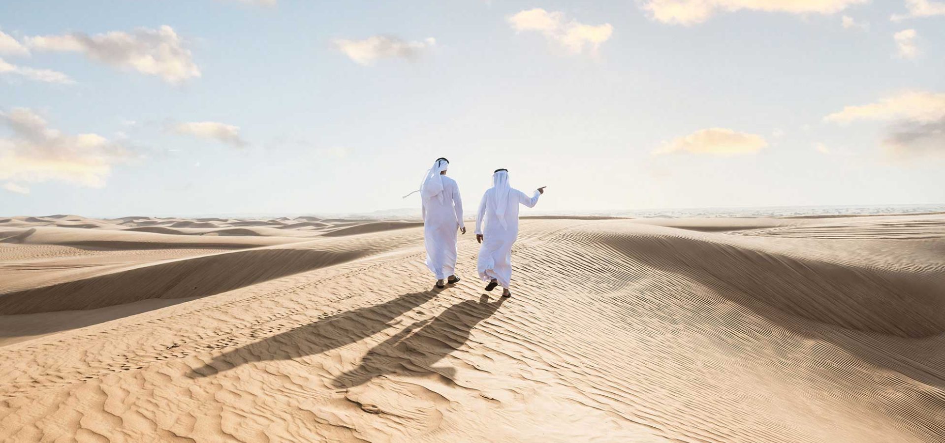 two-middle-eastern-emirati-men-wearing-arab-kandur-SVVRRQN-1.jpg